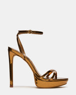 JUNI Bronze Criss Cross Stiletto Ankle Strap Women's Heel | Steve Madden
